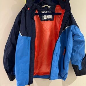 Helly Hansen Kids Raincoat (size 9) in Blue and Navy with rain pants (size 8)